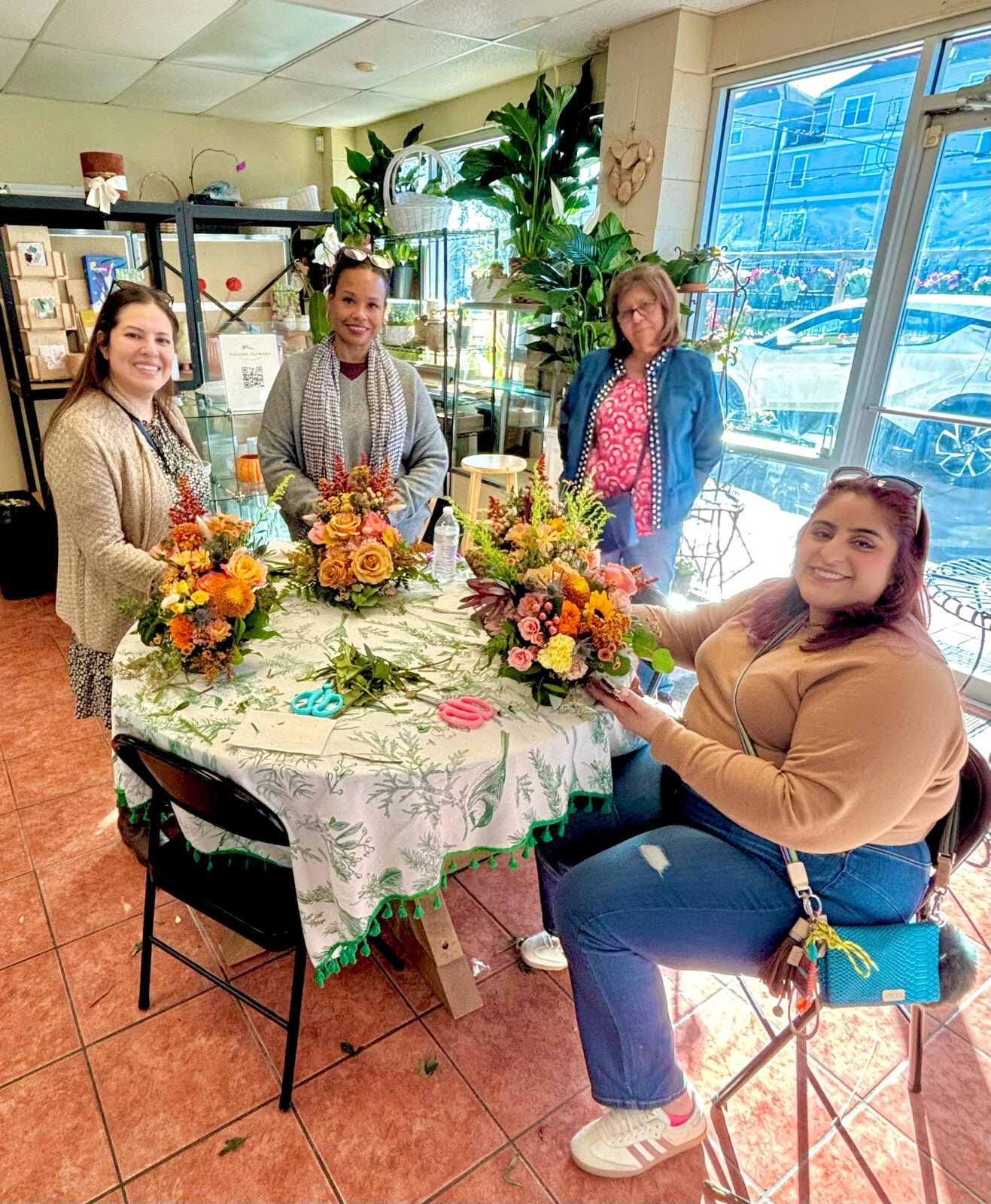 Legacy physicians creating floral arrangements at a physicians event